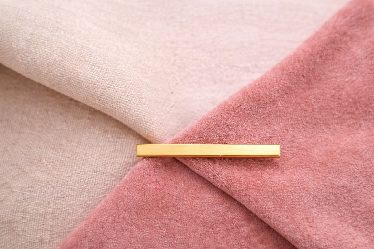 Soft beige linen layered over blush velvet ,symbolizing feminine boundaries that are gentle yet firm.
